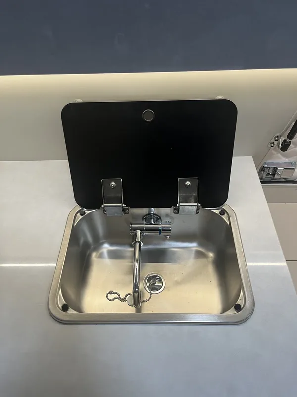 Stainless camper sink with glass lid