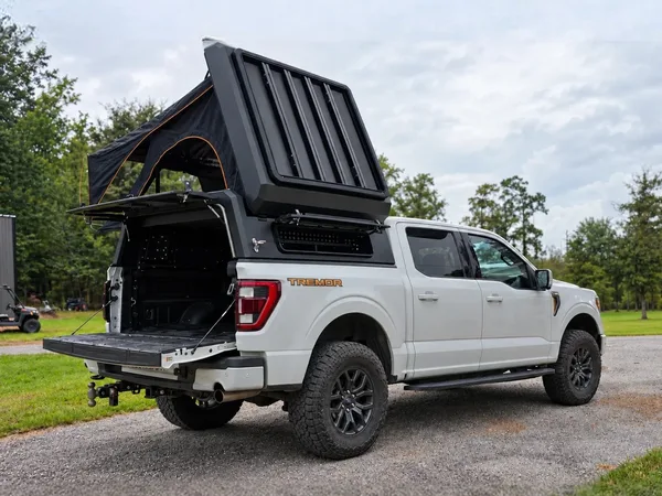 Stealth pop-up topper open on a white Ford F-150