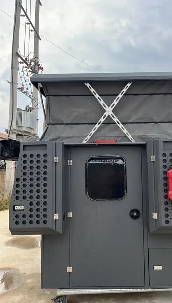 SUNHOMEE flatbed camper body with the pop-up roof raised