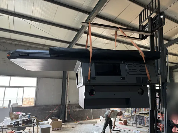 Camper body being lifted for fitting in the SUNHOMEE workshop